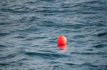 photo of buoy on body of water